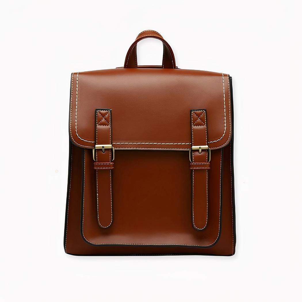 Una mochila tipo satchel de estilo vintage que puede llevarse a la espalda o colgada del hombro. Un espacioso compartimento principal con un pequeño bolsillo con cremallera en el interior y un bolsillo frontal para que pueda llevar todo lo que necesite, vaya donde vaya, ¡con estilo! La mochila satchel de estilo vintage es un producto de calidad que añade un toque de elegancia y sofisticación a su look. Su diseño único y su aspecto atemporal la convierten en un accesorio esencial para el día a día.