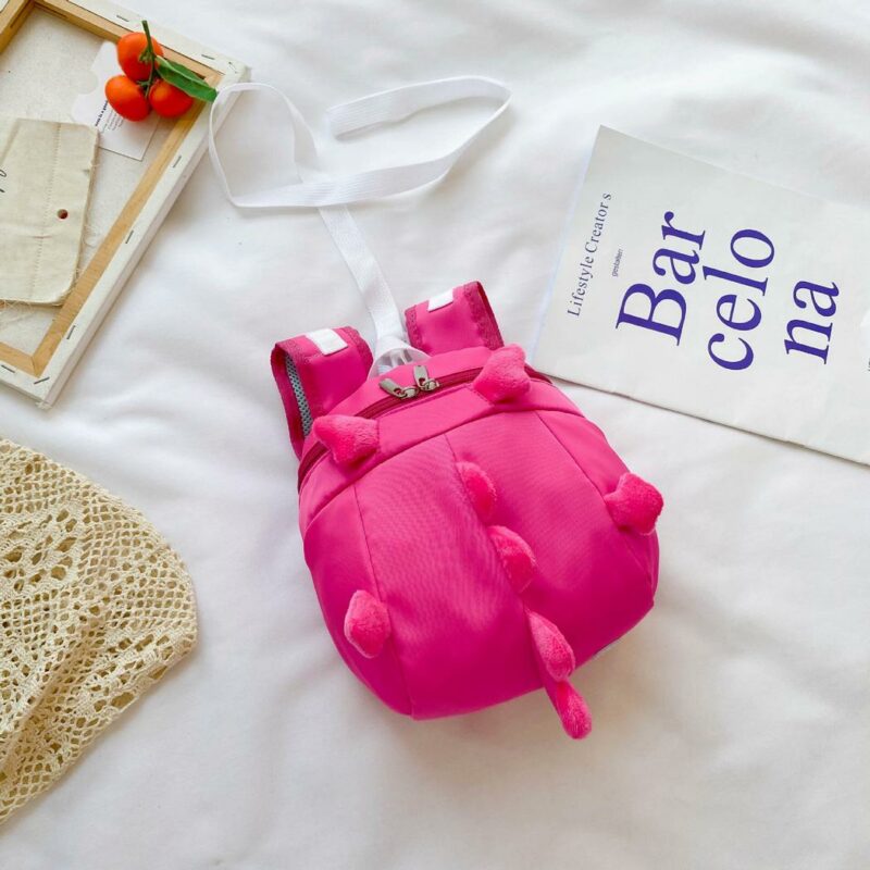 Mochila preescolar dinosaurio rosa con cama blanca