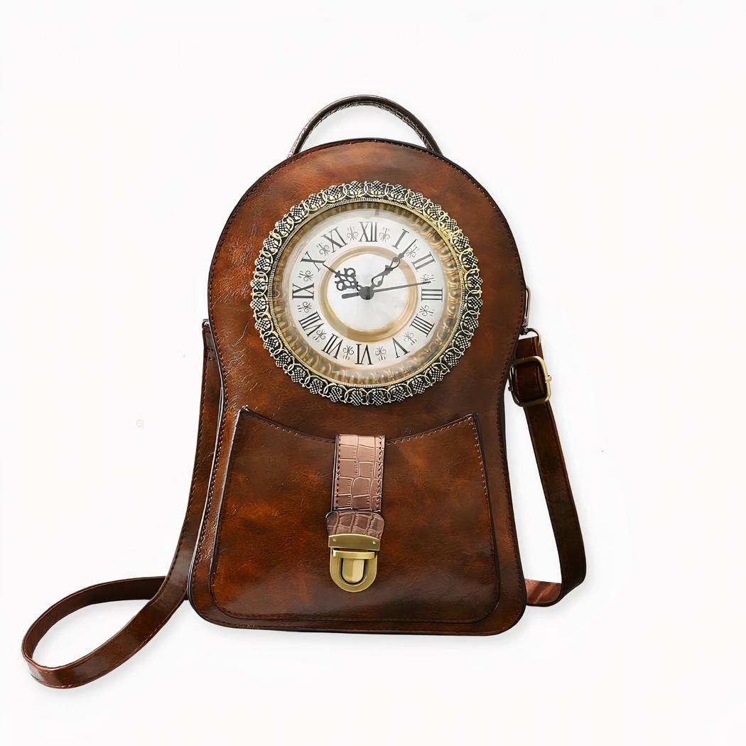 Viaje en el tiempo con esta mochila vintage de imitación de cuero ¡con un reloj! Disponible en rojo, negro y marrón, elija la que más le guste. Su forma original, sus detalles dorados y su reloj antiguo de aspecto real la convierten en una bolsa única ¡llena de encanto!