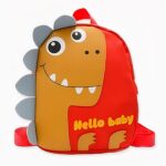 Pequeña mochila tiranosaurio naranja con dientes blancos. Buena calidad y muy a la moda.