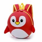 Mochila infantil rígida con pingüinos rojos y blancos