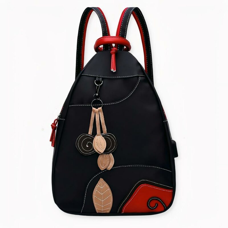 Es difícil no enamorarse de esta bonita mochila de nailon de estilo retro en negro y rojo. Pulcra y elegante, es la bolsa para salir de viaje con estilo y encanto. Esta elegante mochila hará que sus viajes sean más agradables.