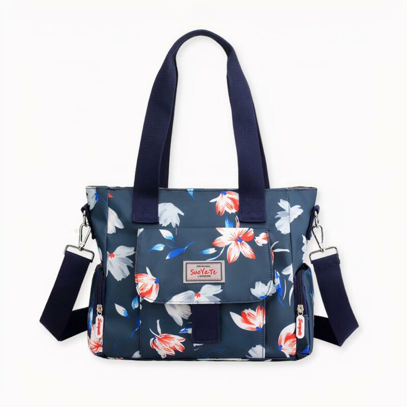 Este bolso de mano con estampado floral para mujer es justo lo que necesita para añadir un toque de estilo a su atuendo de trabajo o de viaje. El tejido de poliéster es moderno y duradero, lo que lo convierte en una opción perfecta para el uso diario. Tanto si se dirige a la oficina como si sale de viaje, este bolso le ayudará a tenerlo todo organizado y a mano.