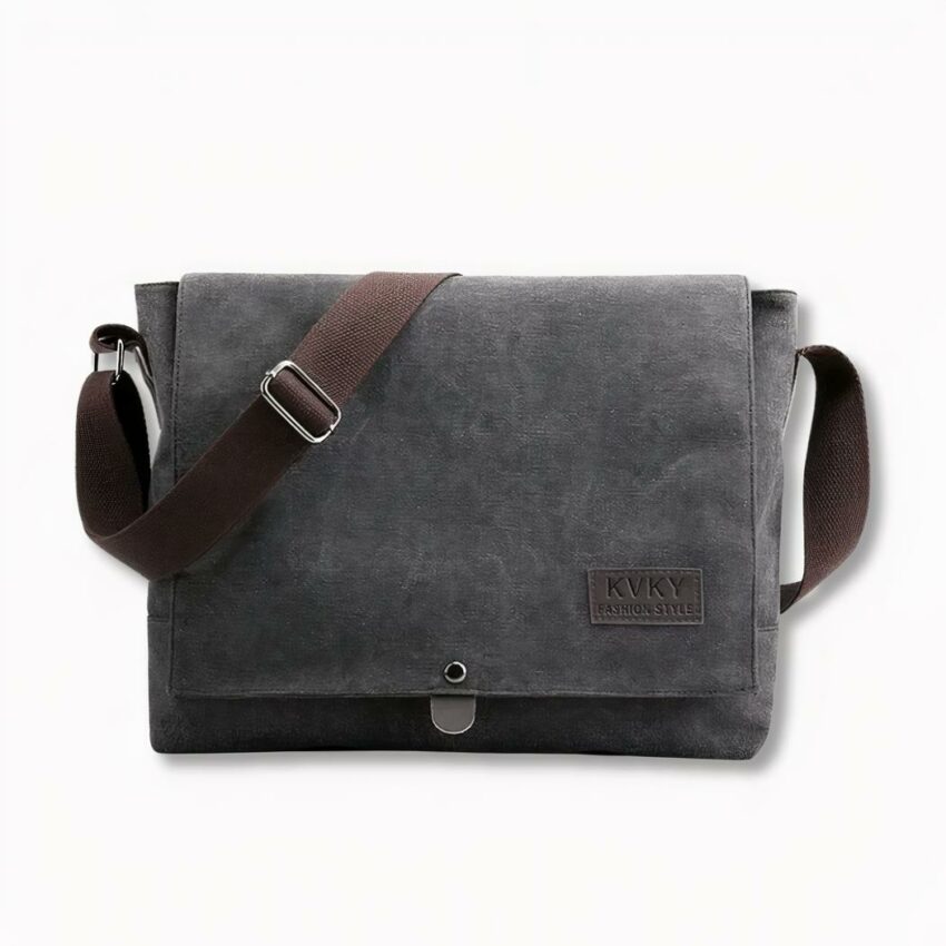 Bandolera de lona gris oscuro para hombre, sobre fondo gris claro