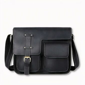 maletín vintage de cuero negro para hombre, sobre fondo gris claro
